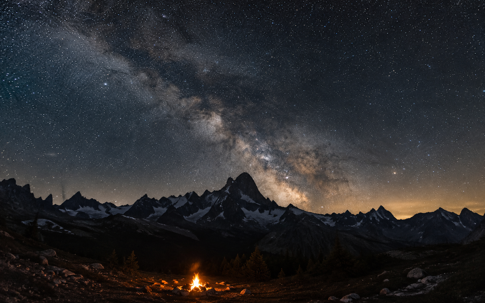A starry sky over a mountain ridge